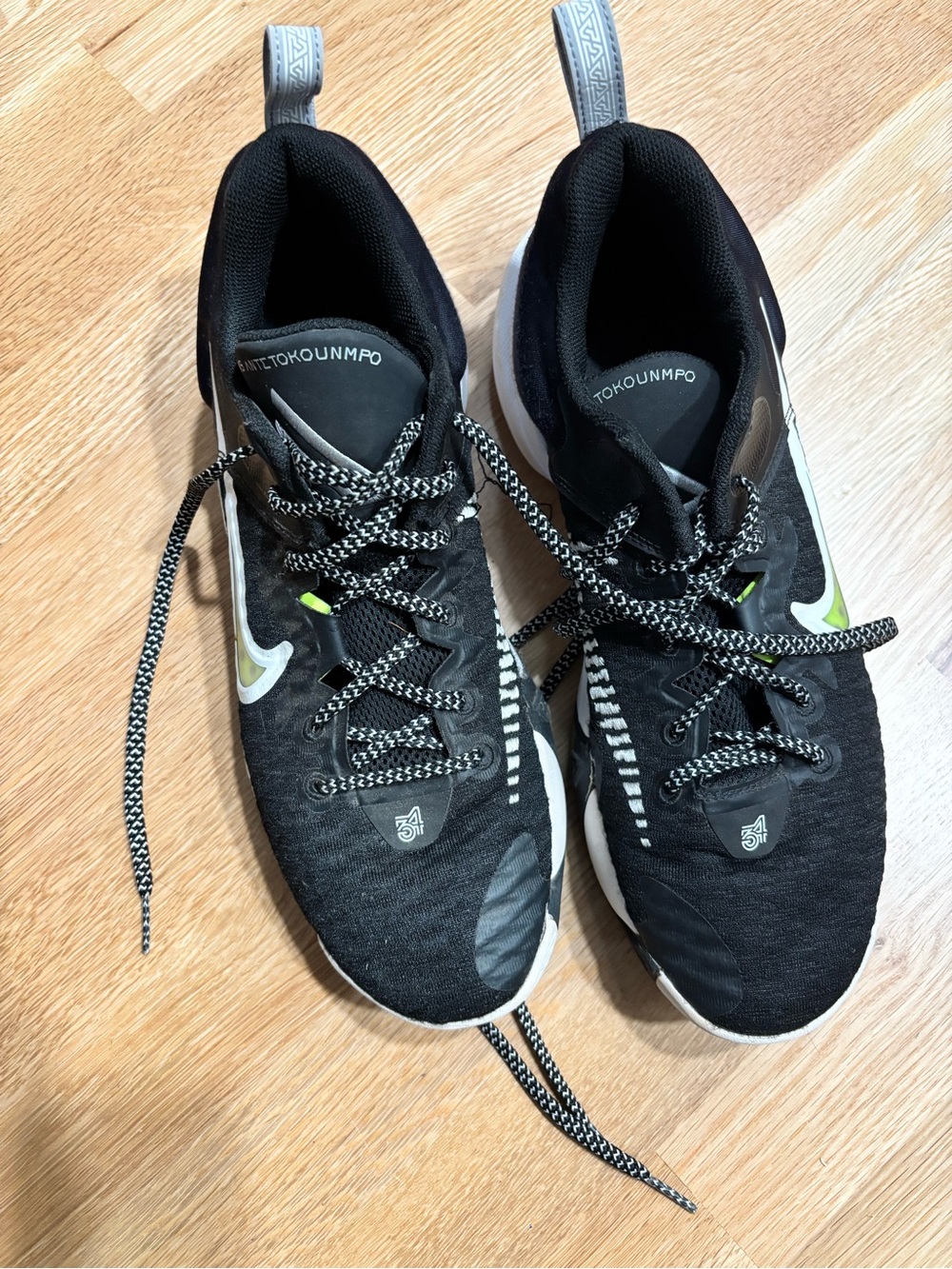 Nike Black Athletic Sneakers with Neon Green Swoosh